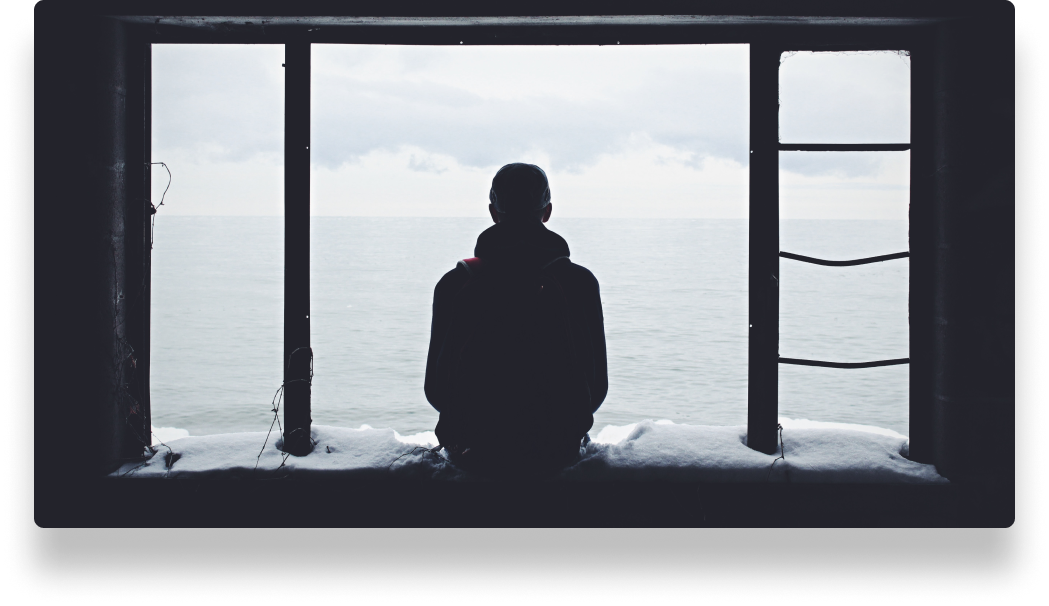 person looking out of window